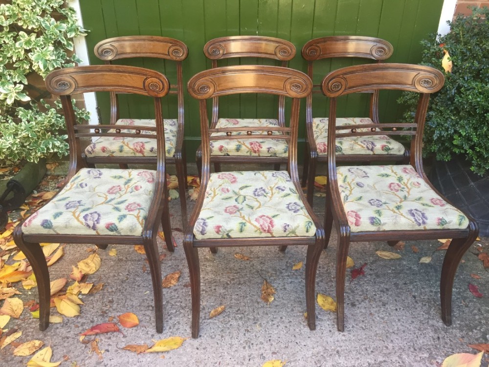 Set of 6 early C19th Regency mahogany sabre-leg dining chairs.