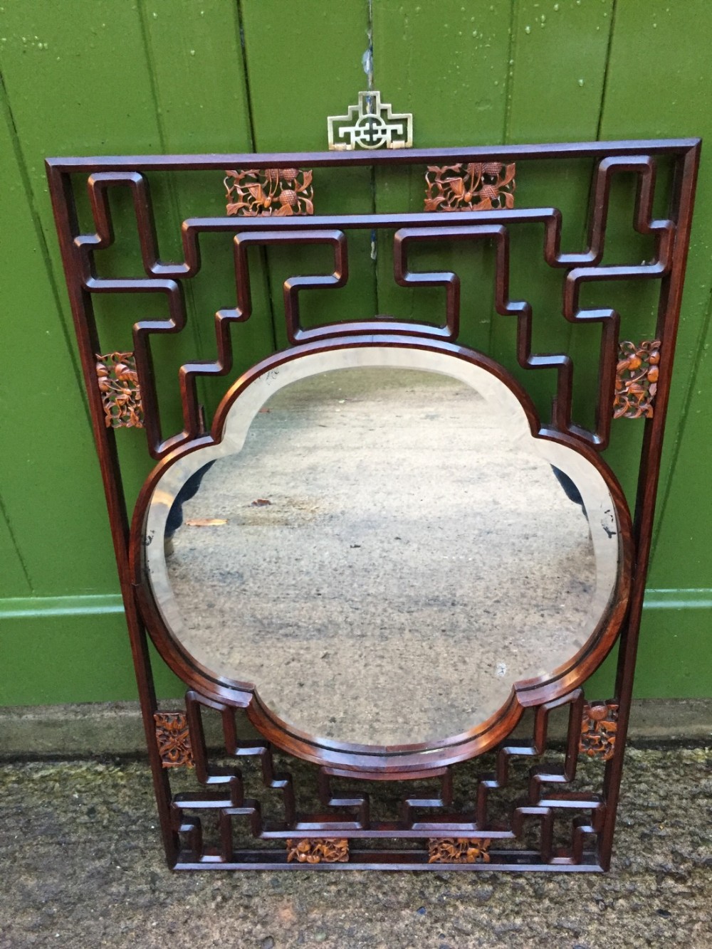 Early C20th Chinese hardwood open fret-work framed wall mirror with carved boxwood decoration .