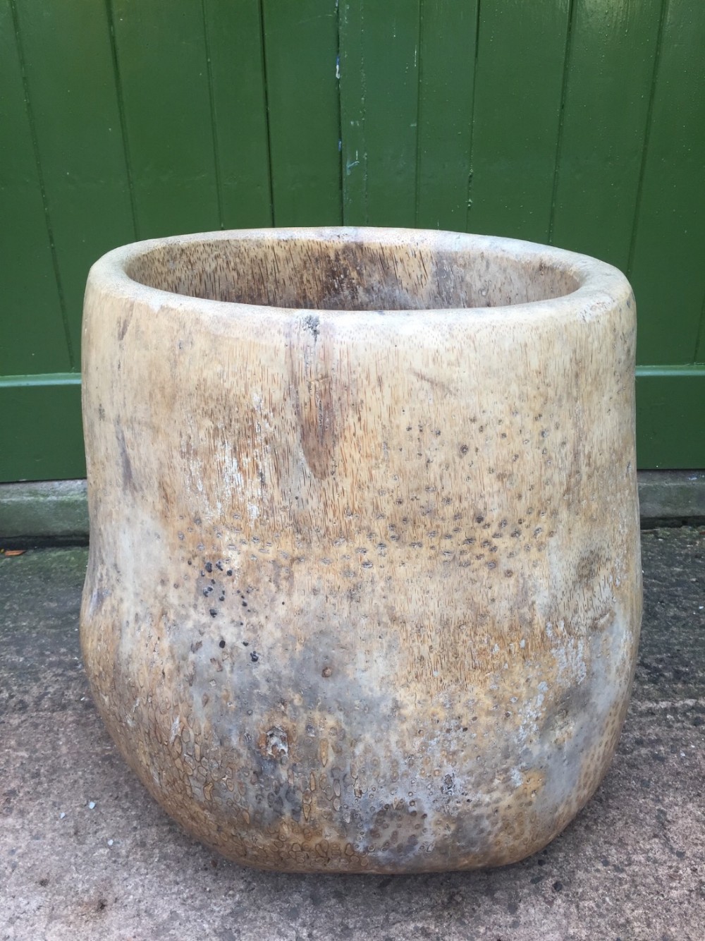 Large early C20th palm-wood 'dug-out' mortar or planter.