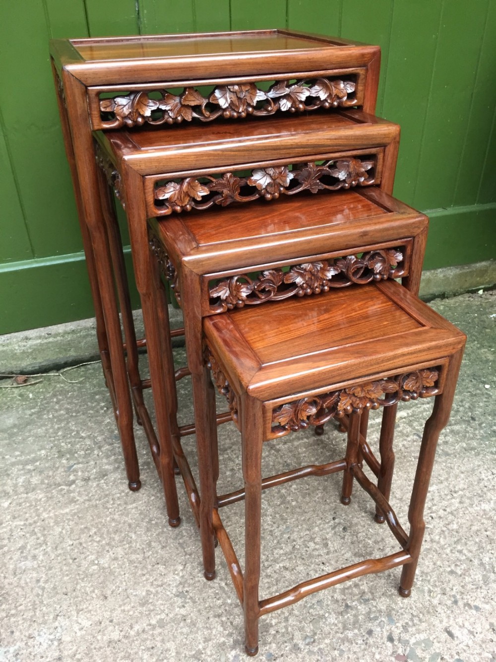 Late C19th Chinese Qing Dynasty quartetto of carved hardwood nesting tables.
