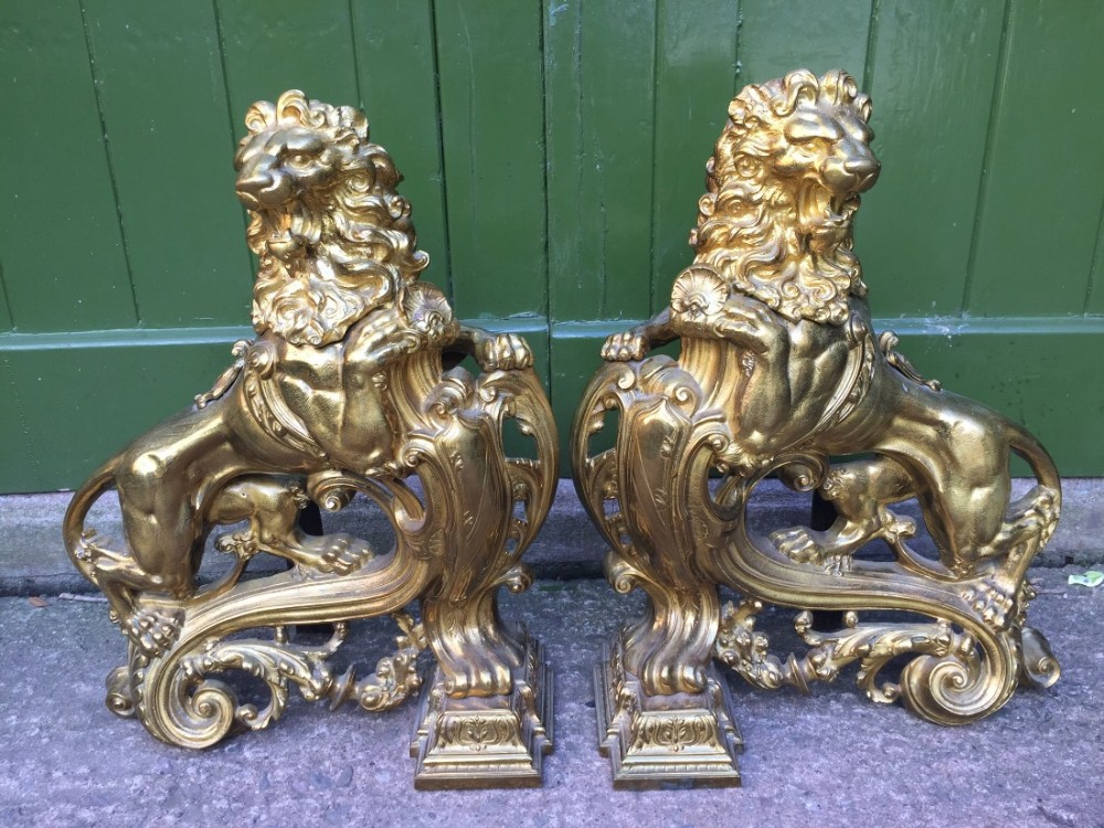 Magnificent pair of large-scale C19th French Louis XVI style ormolu bronze fireplace 'chenets' cast as rampant lions .