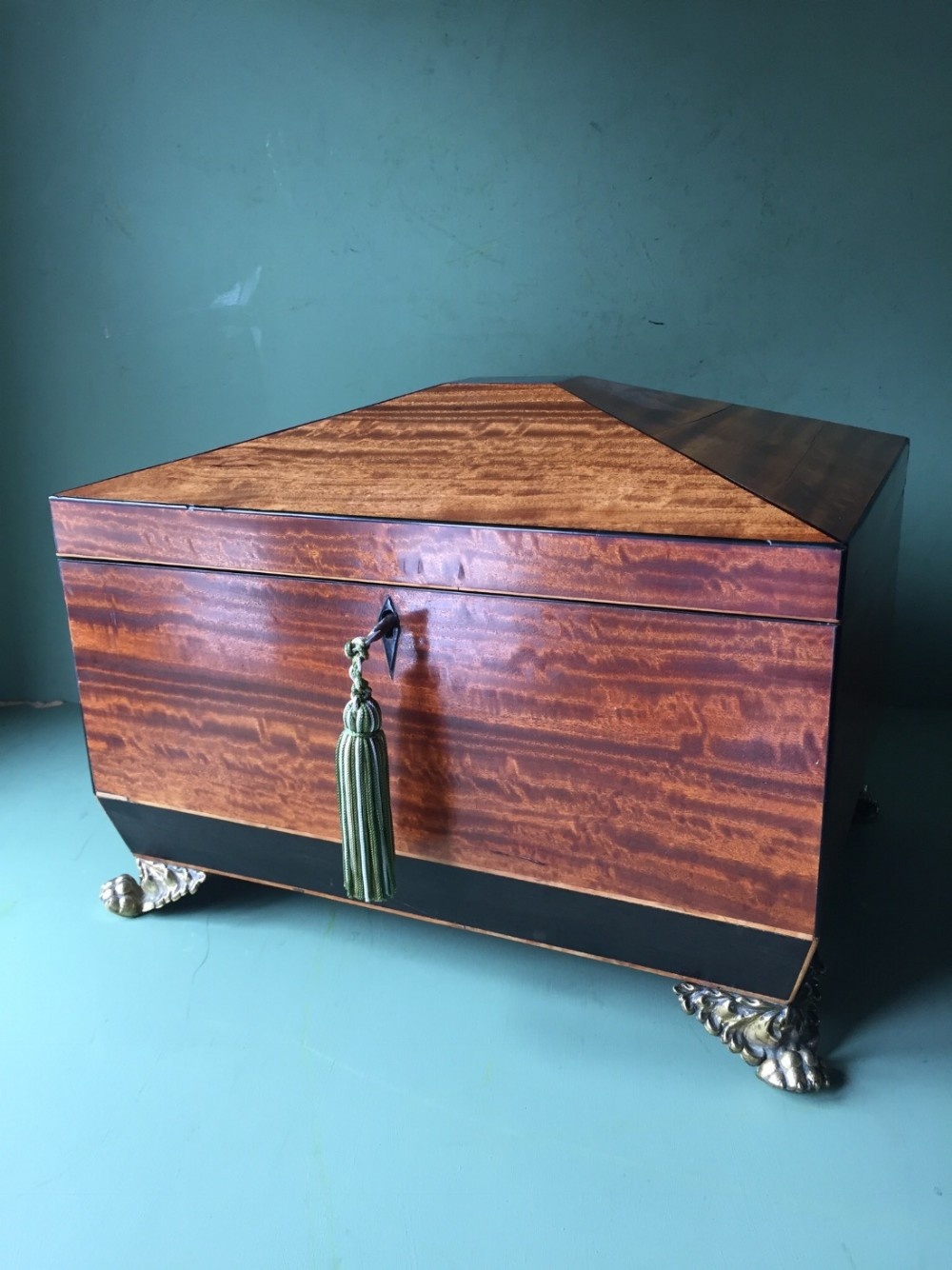 Early C19th Regency period satinwood and ebony sewing casket or box of sarcophagus form .