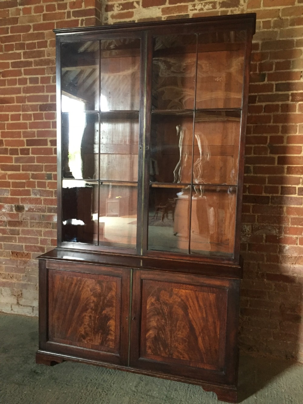 Fine C18th early George III period mahogany library bookcase with a fitted cupboard base ,in outstanding totally original and untouched condition.