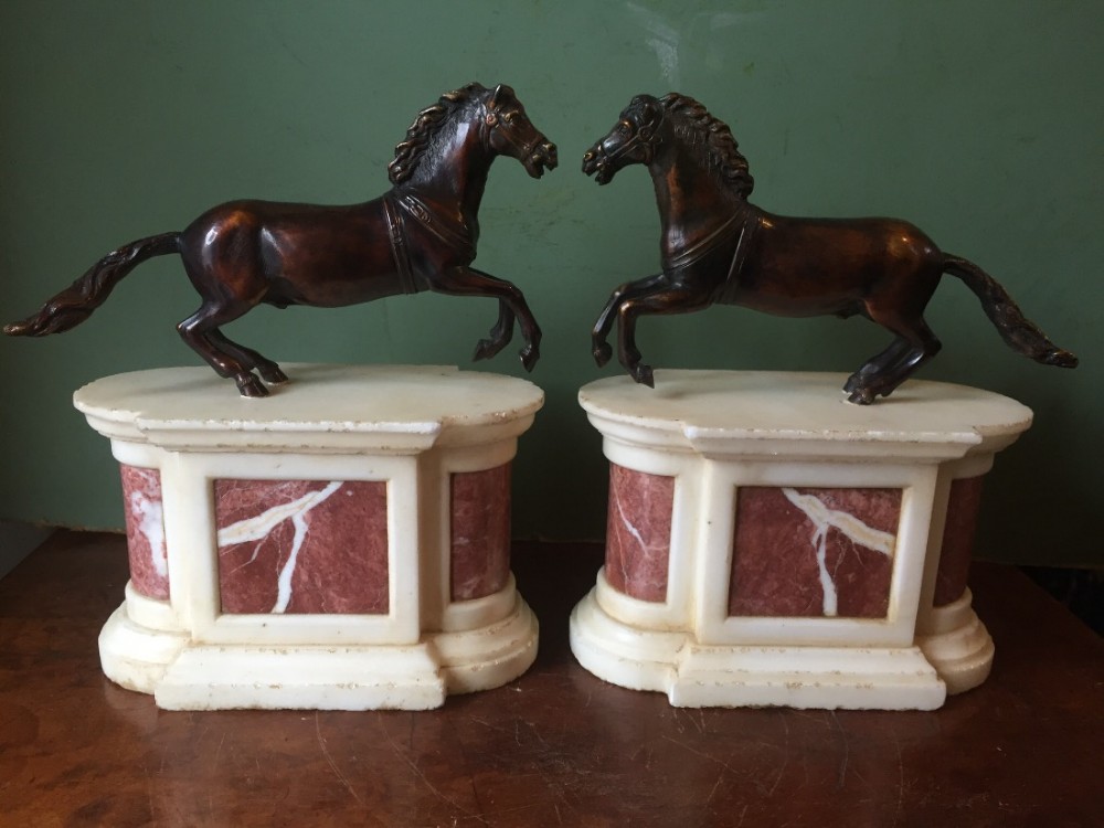 Pair of C19th Baroque style bronze galloping horse studies on marble plinth bases in the manner of Francesco Fanelli .