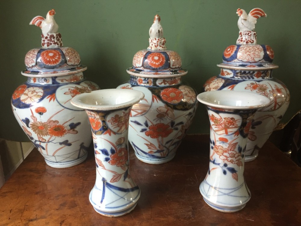 Garniture of 5 early C19th Japanese Imari pattern porcelain vases of small proportions.