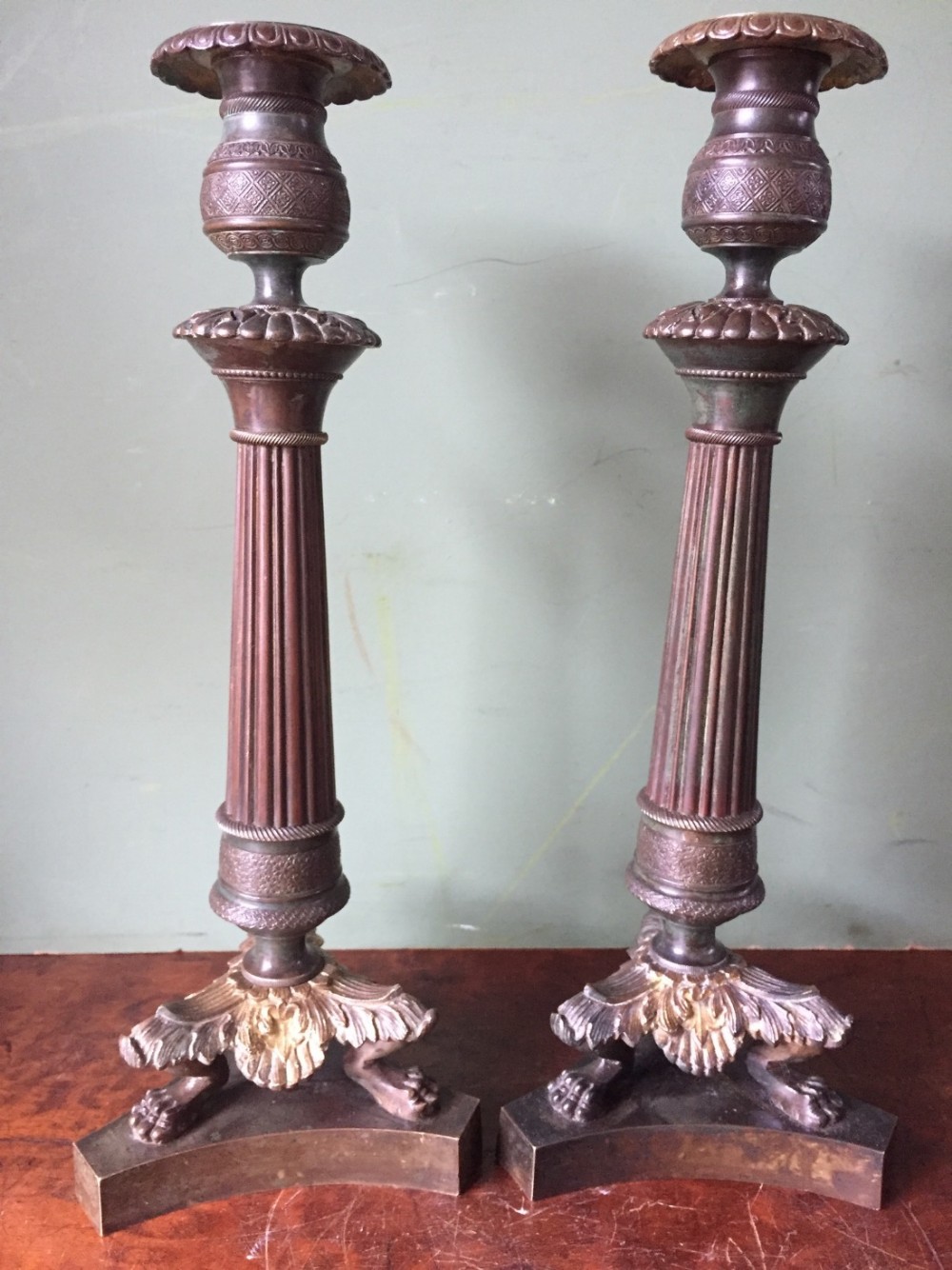 Pair of early C19th French Charles X period bronze Empire design candlesticks.