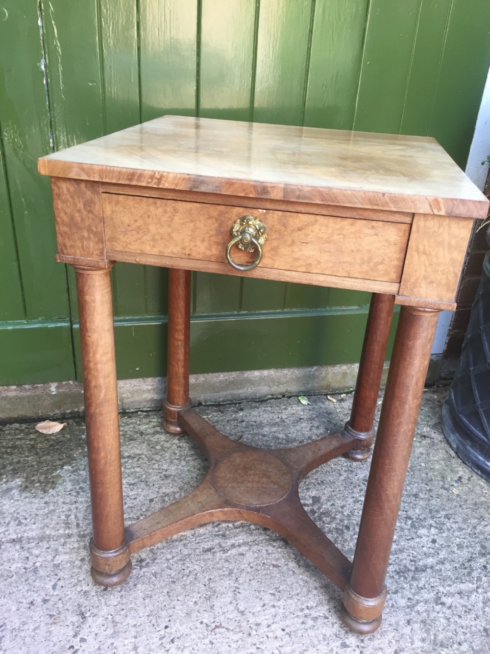Early C19th figured mahogany table of Empire design with a pleasing faded patina.