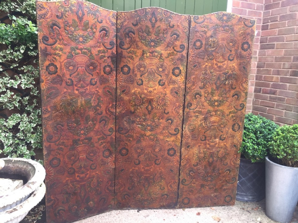 Late C19th embossed leather 3-fold screen or room divider with arched top.