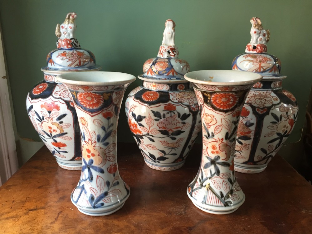Early C18th Japanese Imari pattern composite garniture of 5 vases.