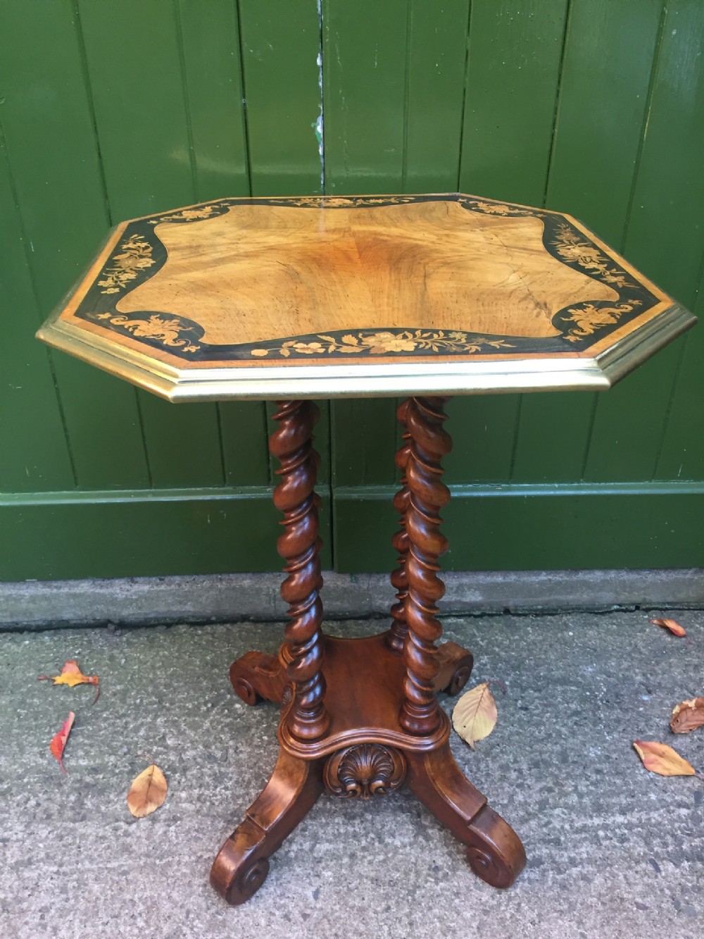 Mid C19th walnut and marquetry inlaid occasional or lamp table.