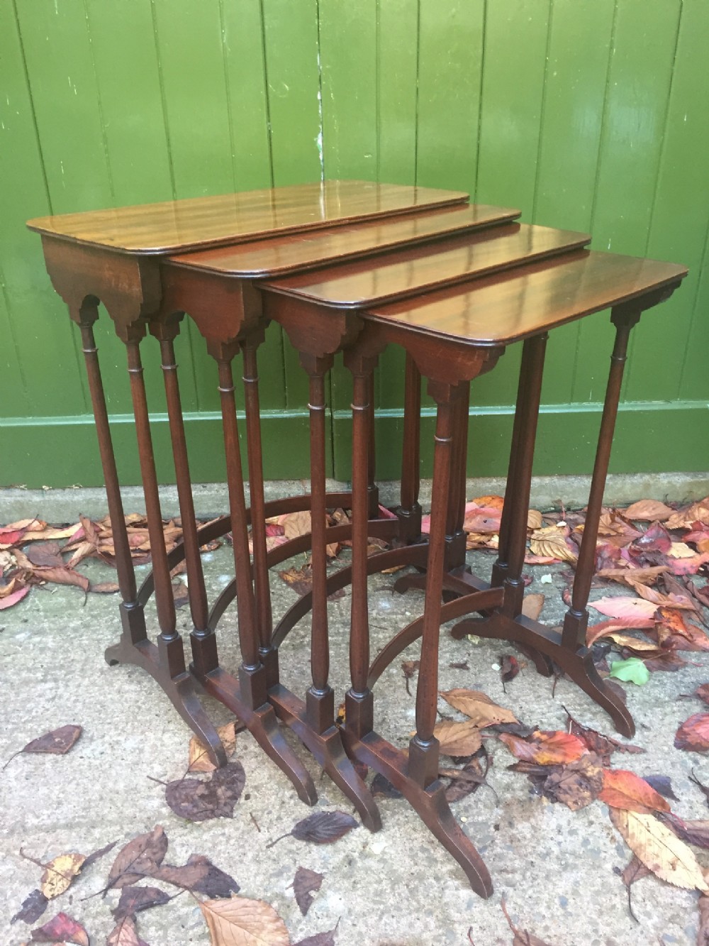 Elegant early C19th George IV period 'quartetto' of nesting mahogany occasional tables.