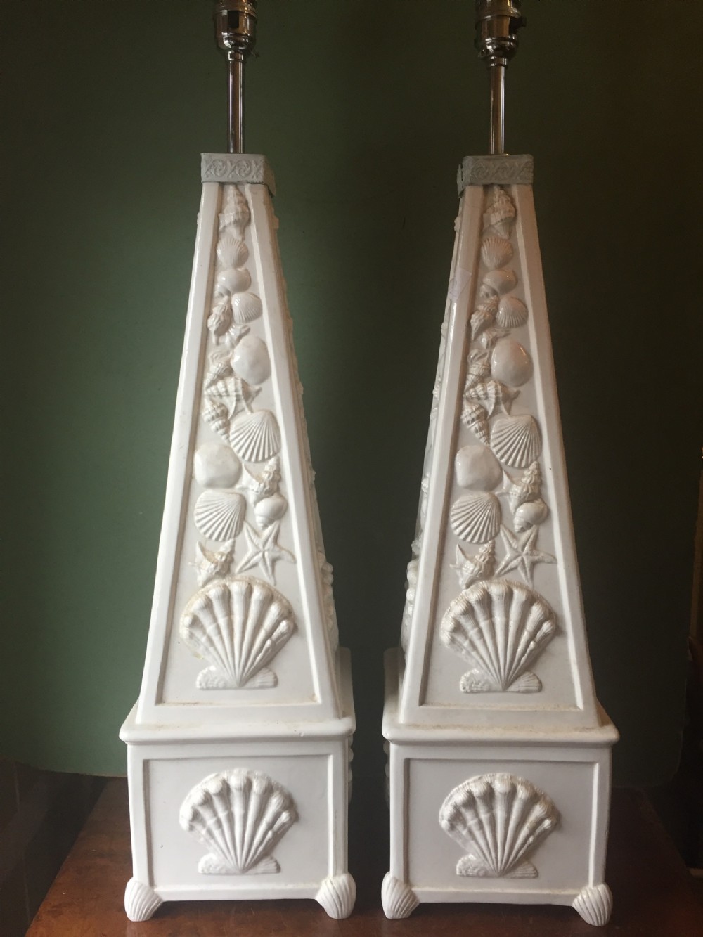 Highly decorative pair of early C20th Italian pottery lamps of obelisk form with raised 'sea-shell' decoration.