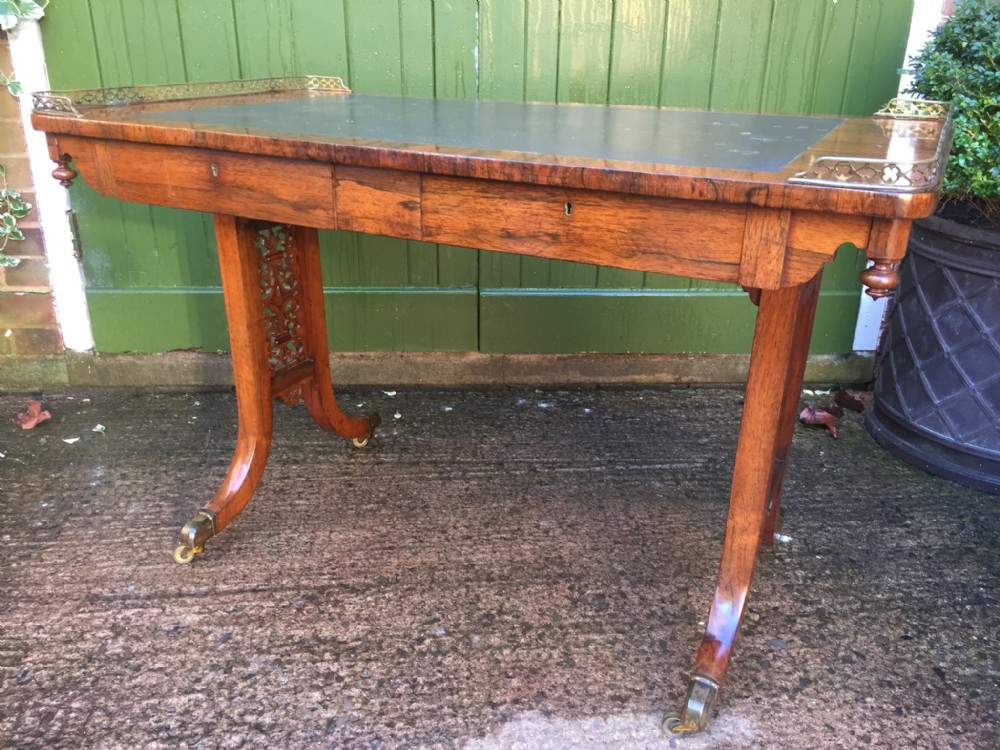 C19th William IV period rosewood writing or library table in the manner of Gillows of Lancaster and London.