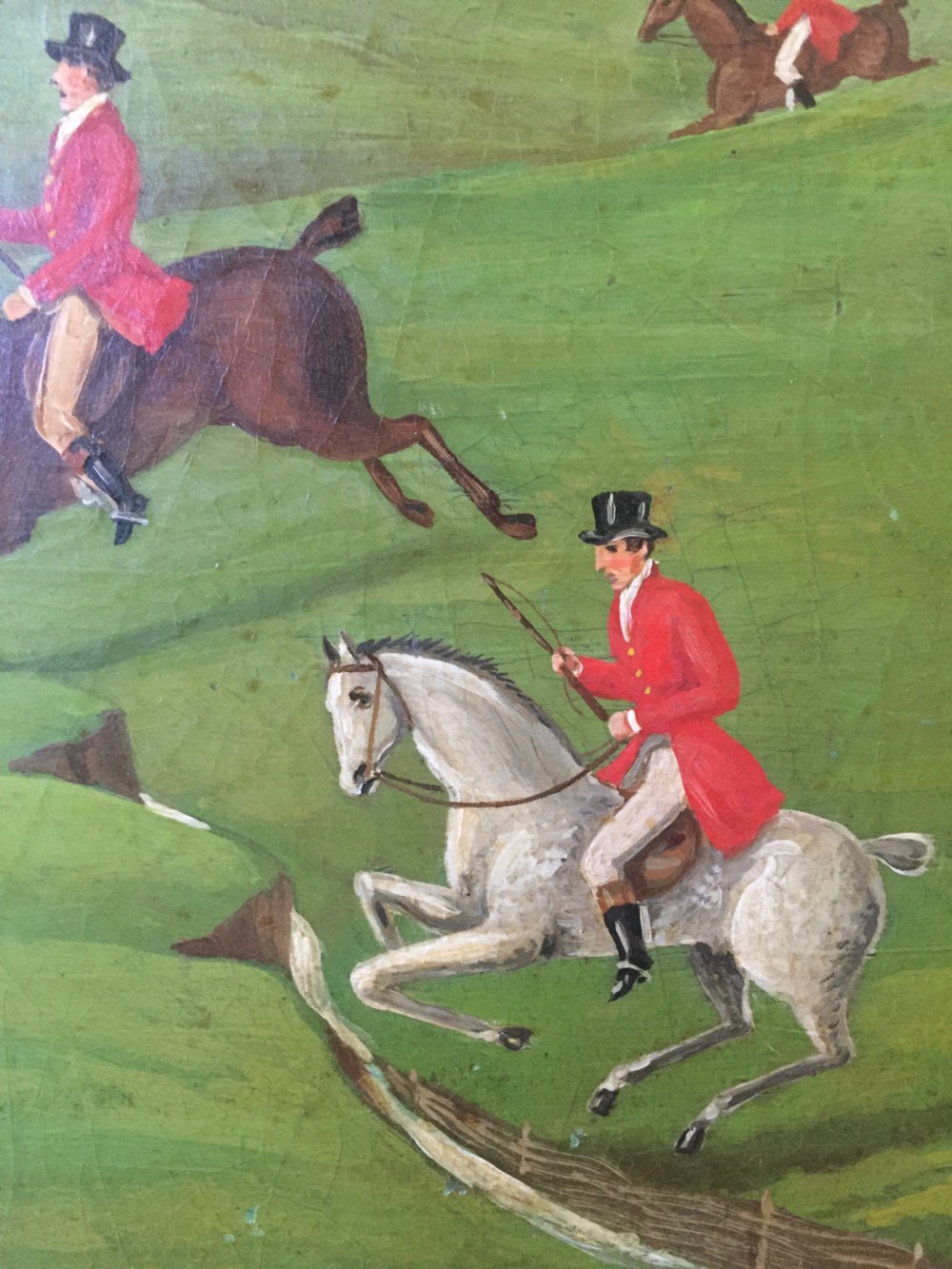 An early 19th-century rectangular papier-mache tray featuring a gilded scrollwork border and a central hand-painted scene of horsemen and hounds engaged in a fox hunt across a countryside landscape. View VIII