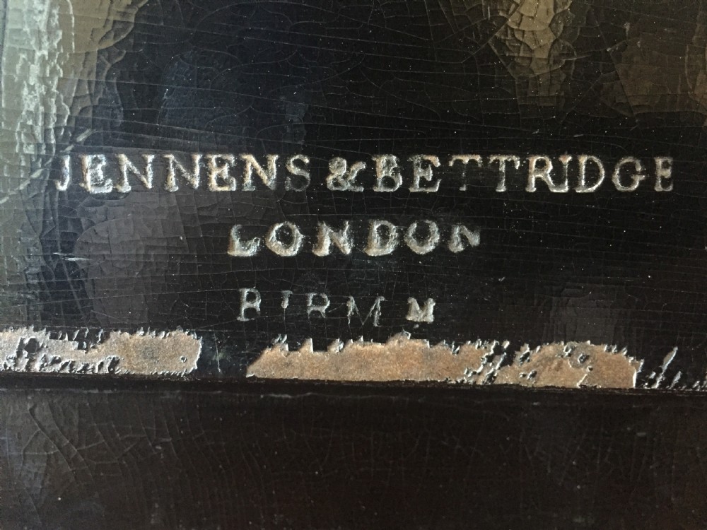 An early 19th-century rectangular papier-mache tray featuring a gilded scrollwork border and a central hand-painted scene of horsemen and hounds engaged in a fox hunt across a countryside landscape. View XIII