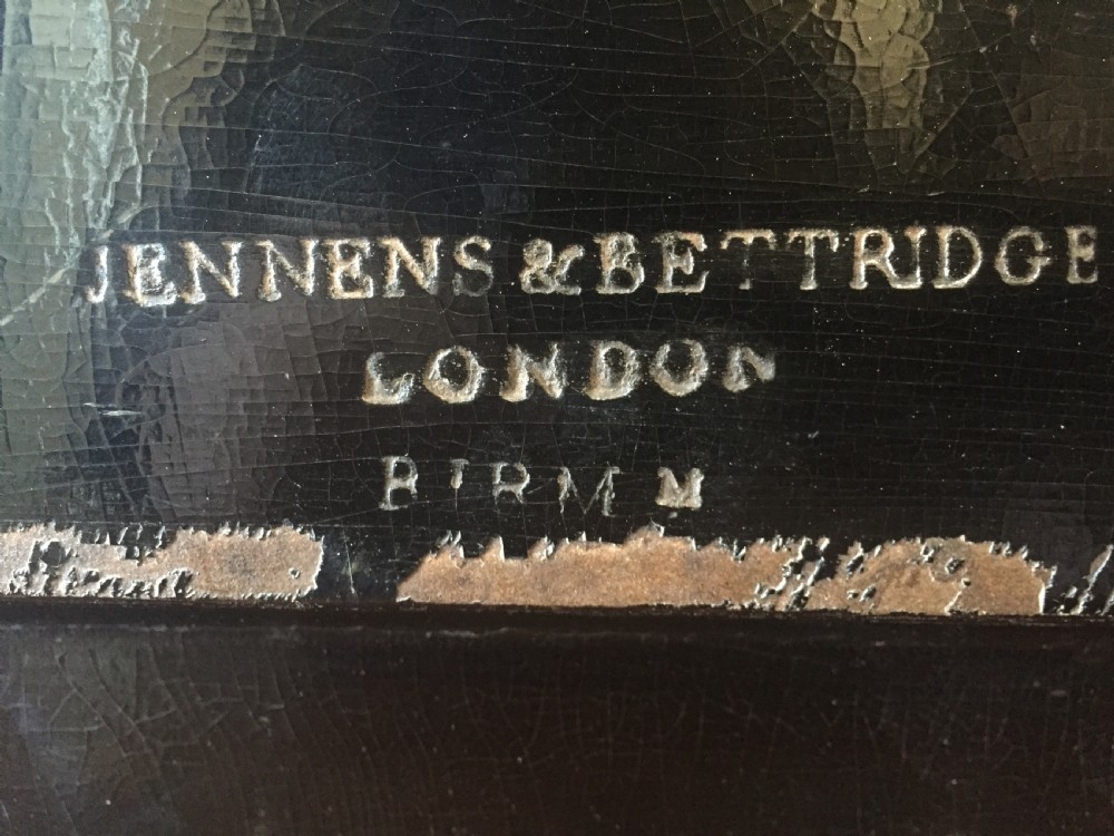 An early 19th-century rectangular papier-mache tray featuring a gilded scrollwork border and a central hand-painted scene of horsemen and hounds engaged in a fox hunt across a countryside landscape. View XIV
