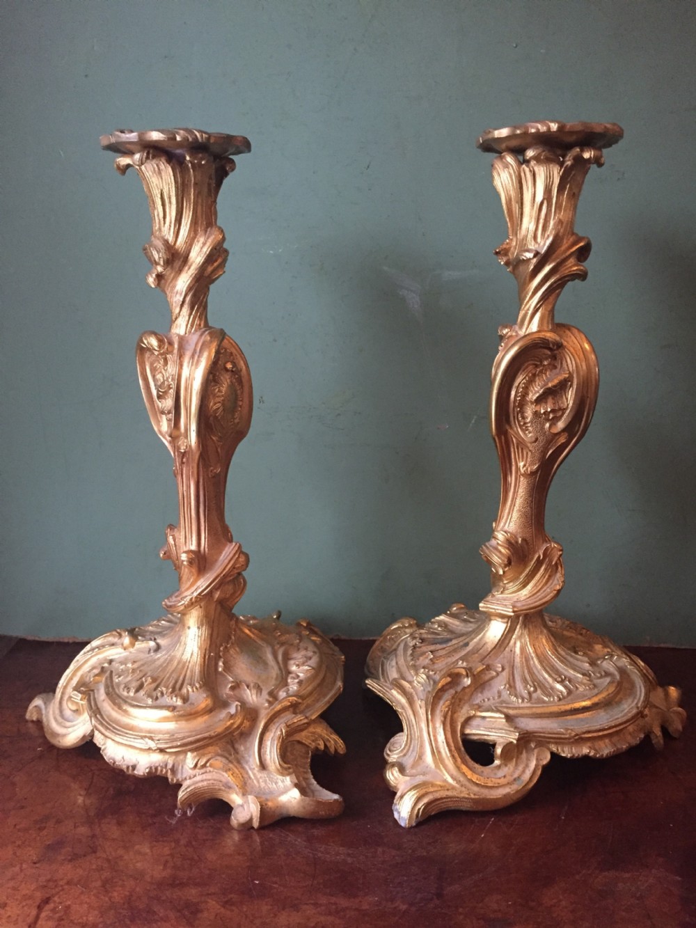 Pair of mid C19th French ormolu bronze candlesticks of Louis XVI rococo design.
