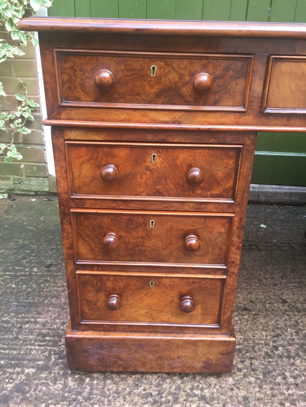Exceptional quality mid-C19th Victorian burr-walnut pedestal desk of practical proportions. View XIX