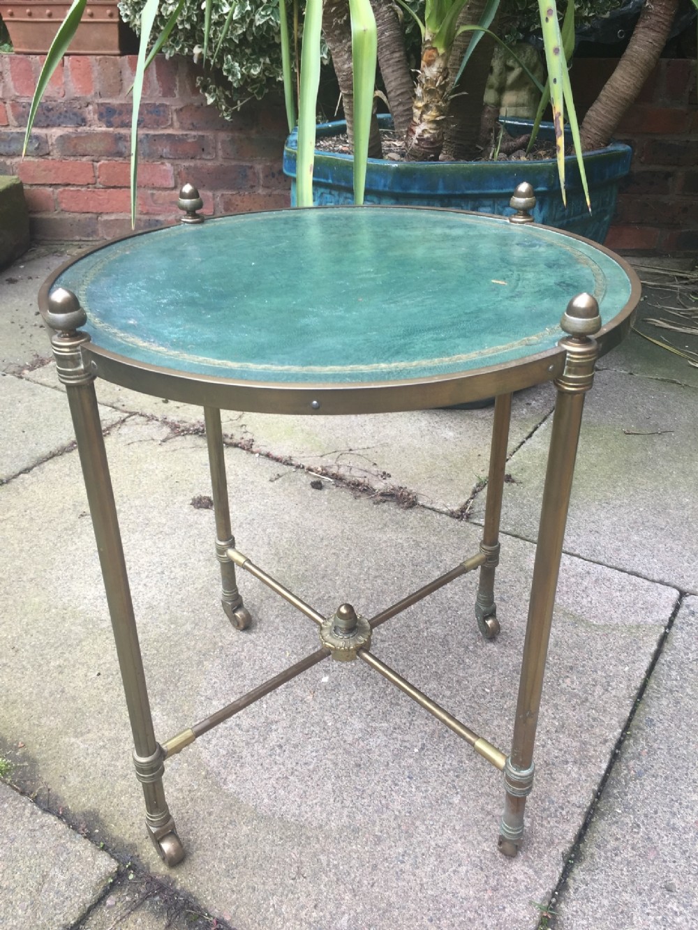 Early C20th brass-framed and leather-top circular occasional or lamp table.