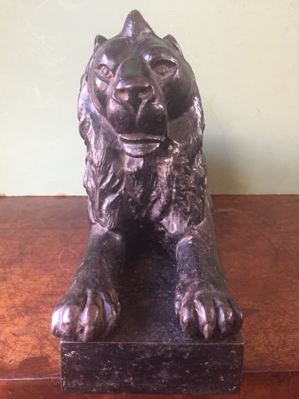 Late C19th cast-iron model of a recumbent lion on a rectangular plinth base. View VIII