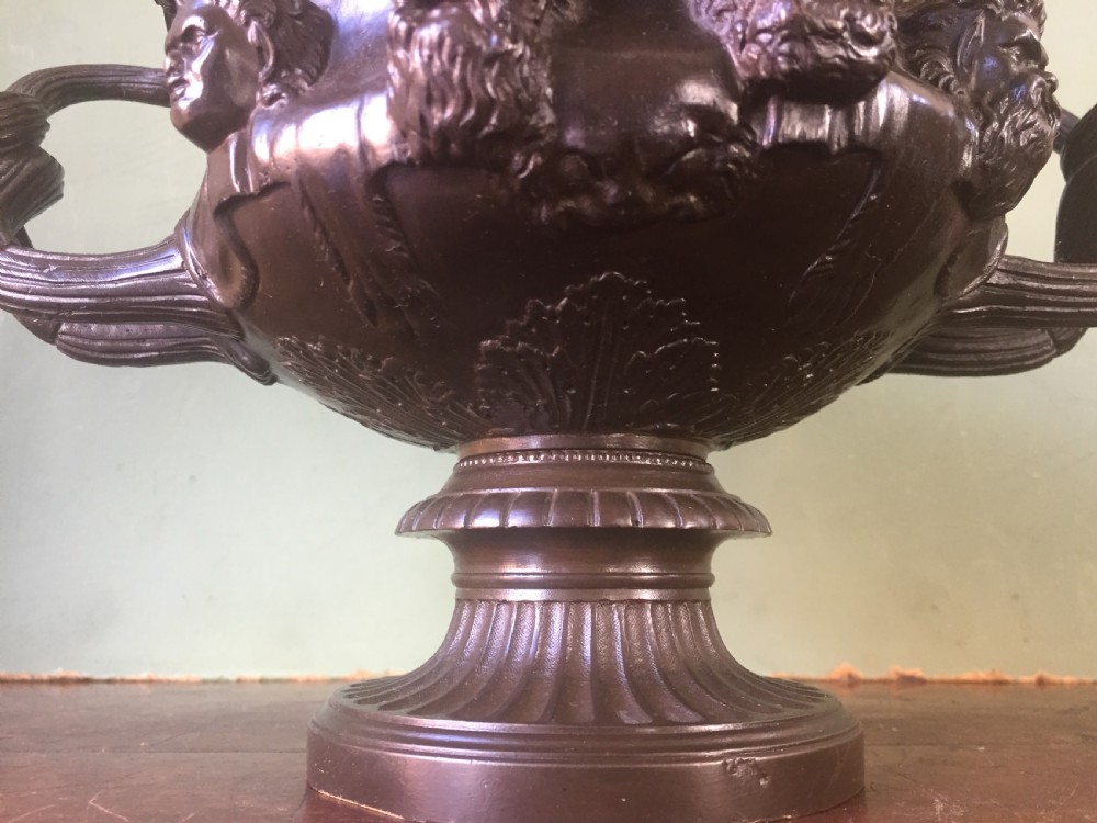 A nineteenth-century dark bronze reduction of the Albani Vase featuring classical sculpted masks along the body, intertwined handles, and a pedestal base. View XII