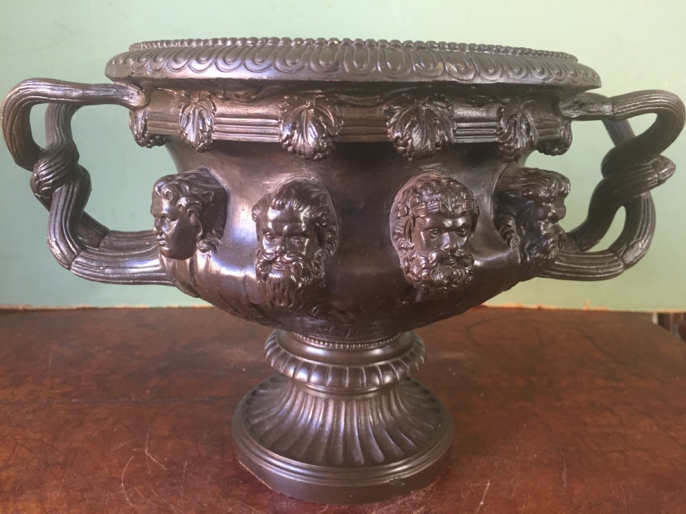 A nineteenth-century dark bronze reduction of the Albani Vase featuring classical sculpted masks along the body, intertwined handles, and a pedestal base. View XV