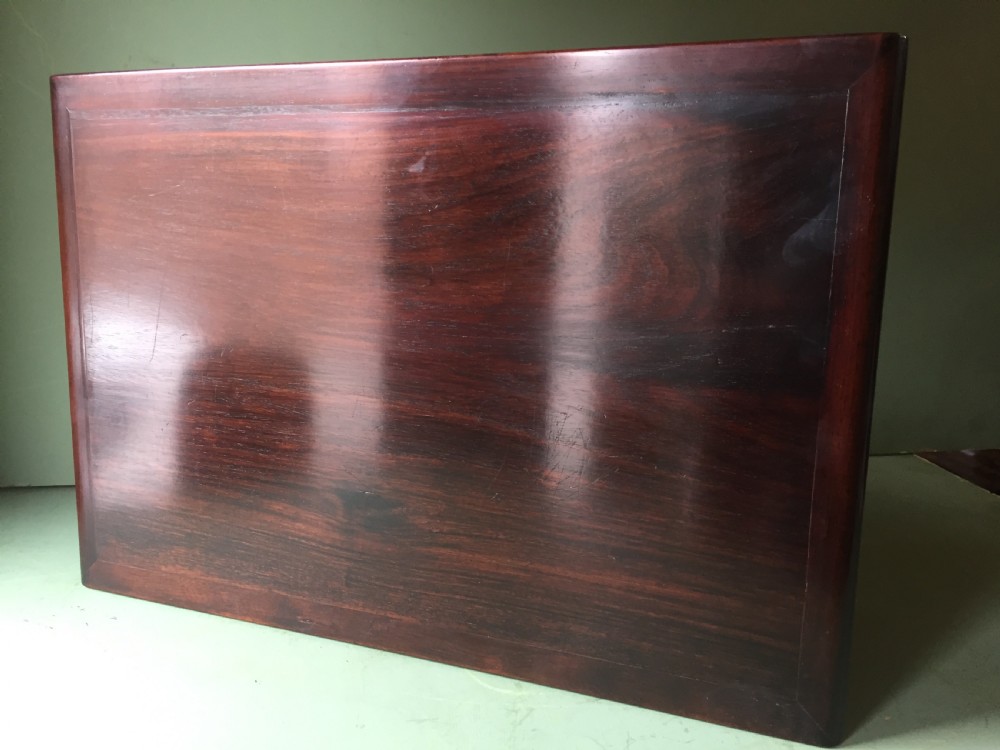 A late 19th-century Chinese dark hongmu hardwood scholars low table featuring carved cloud motif spandrels and straight legs. View XIV