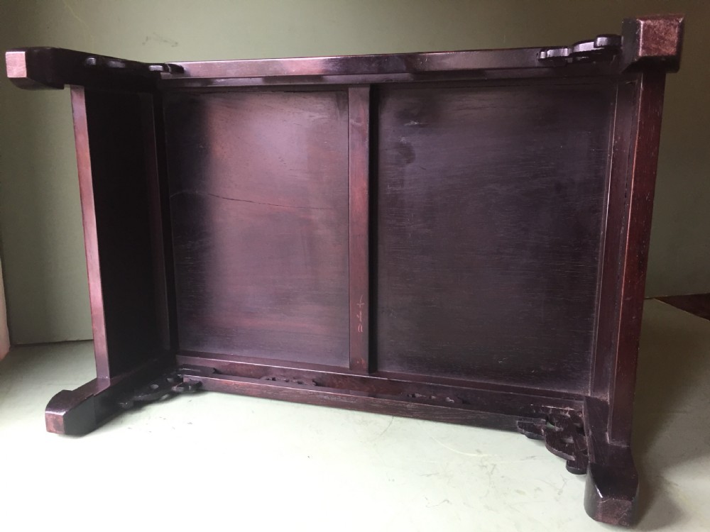 A late 19th-century Chinese dark hongmu hardwood scholars low table featuring carved cloud motif spandrels and straight legs. View XV