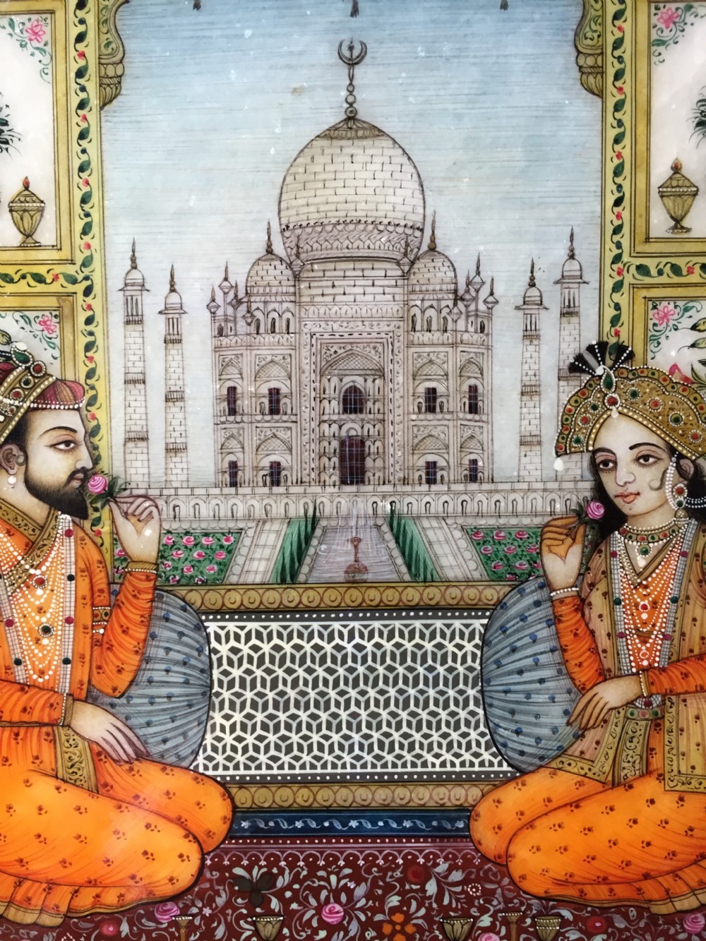 Finely painted early C20th Indian octagonal marble panel depicting Shah Jahan and Mumtaz Mahal , posed on a carpet before the Taj Mahal in Agra. View V
