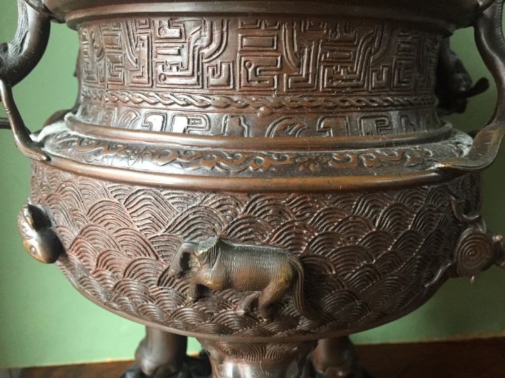 C19th Chinese Qing Dynasty cast bronze 'dragon' censer , or incense burner , and cover on original carved hardwood stand . View X