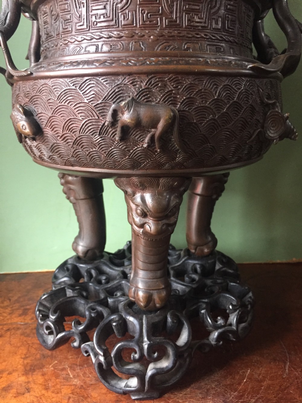 C19th Chinese Qing Dynasty cast bronze 'dragon' censer , or incense burner , and cover on original carved hardwood stand . View XVIII