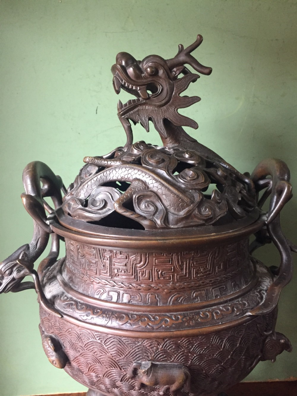 C19th Chinese Qing Dynasty cast bronze 'dragon' censer , or incense burner , and cover on original carved hardwood stand . View XXII
