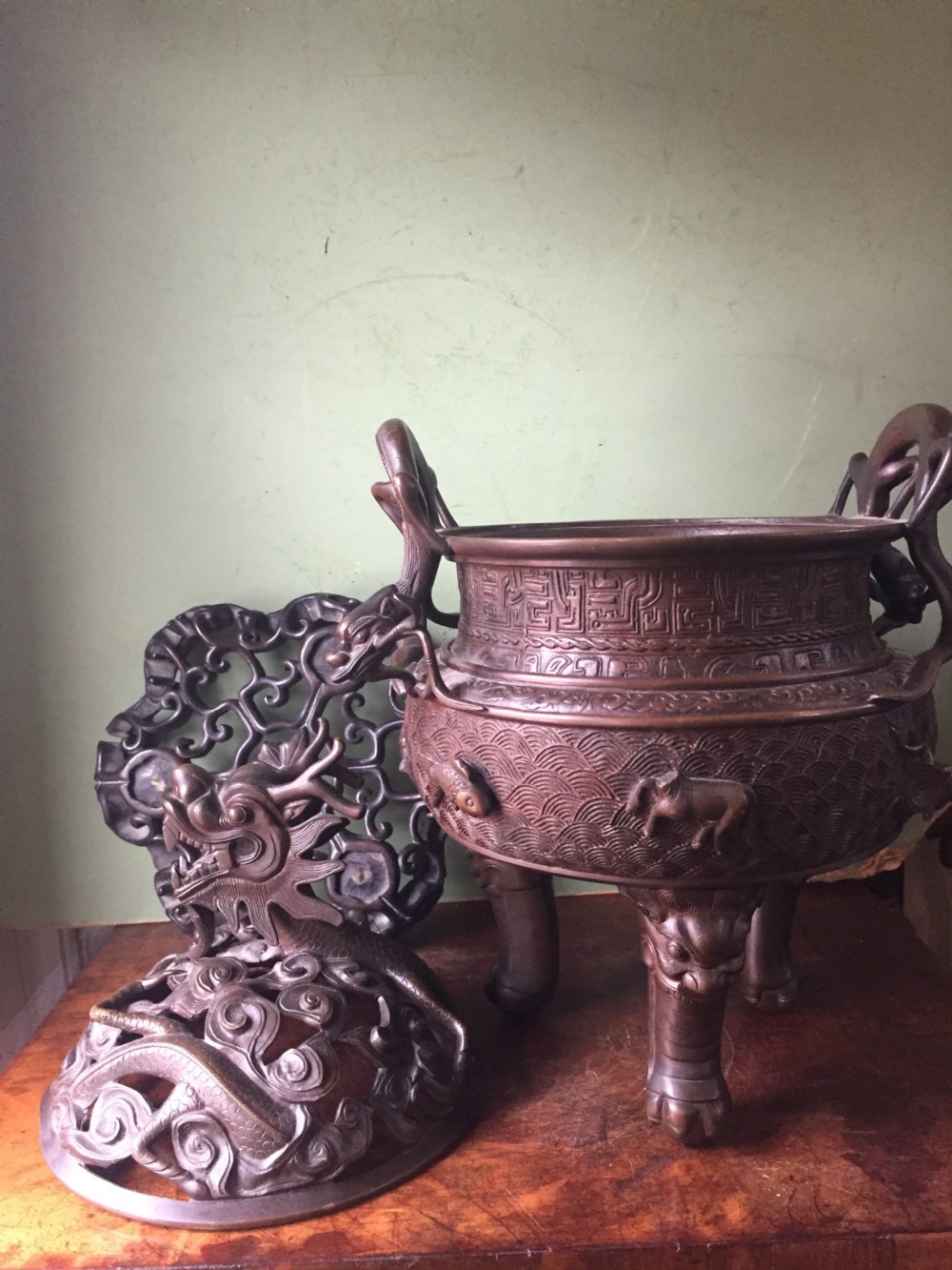 C19th Chinese Qing Dynasty cast bronze 'dragon' censer , or incense burner , and cover on original carved hardwood stand . View XXIII