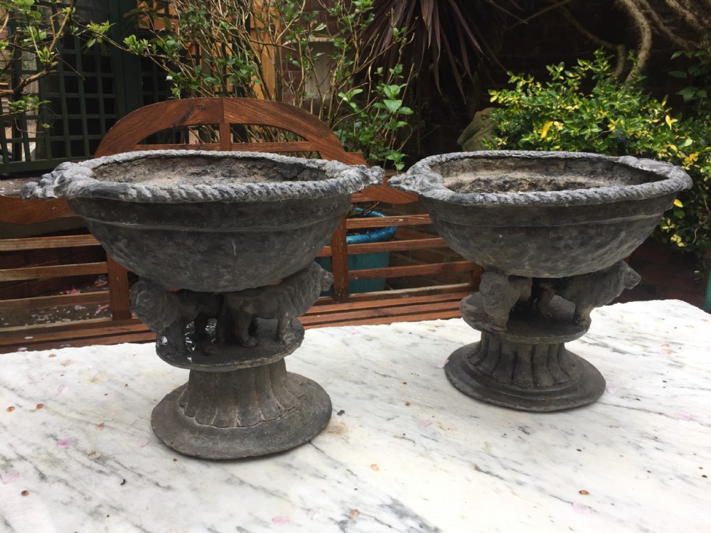 Pair of early C19th lead planters or jardinieres of tazza form raised on unusual triple pacing lion supports.