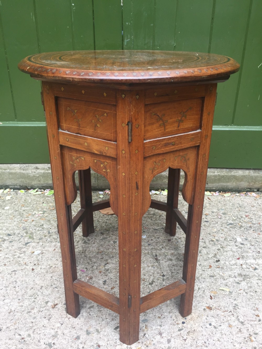 Late C19th Indian brass-inlaid oval teak occasional table on folding arcaded base. View V