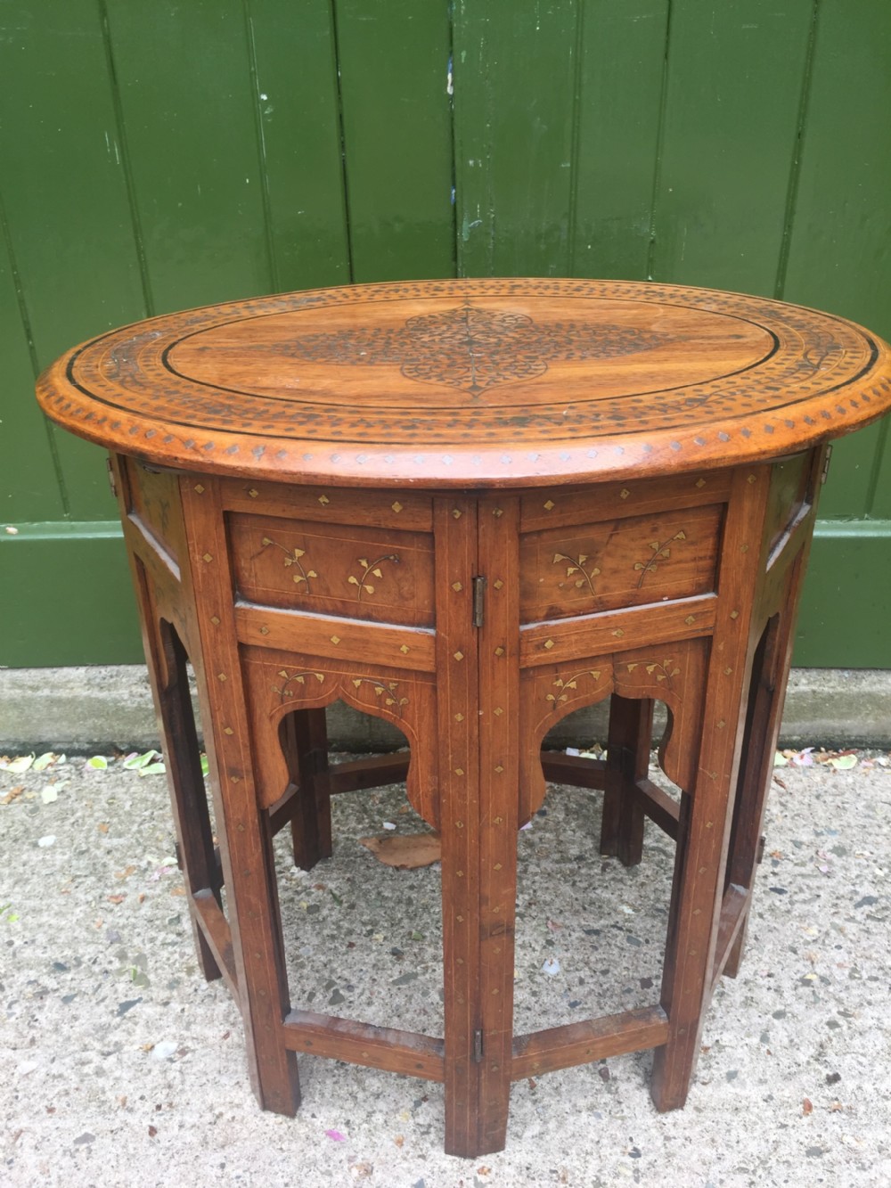 Late C19th Indian brass-inlaid oval teak occasional table on folding arcaded base. View VI