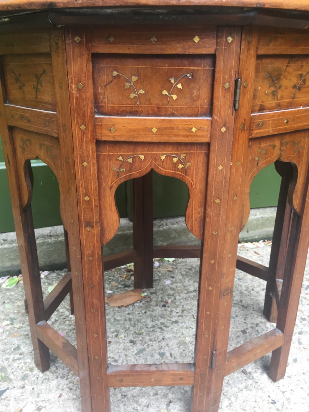 Late C19th Indian brass-inlaid oval teak occasional table on folding arcaded base. View VII