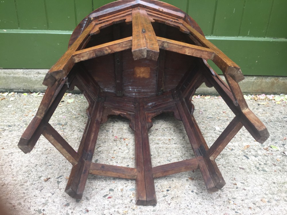 Late C19th Indian brass-inlaid oval teak occasional table on folding arcaded base. View X