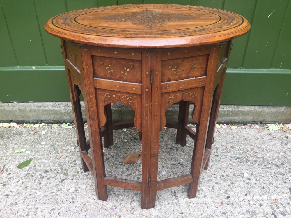 Late C19th Indian brass-inlaid oval teak occasional table on folding arcaded base. View XI