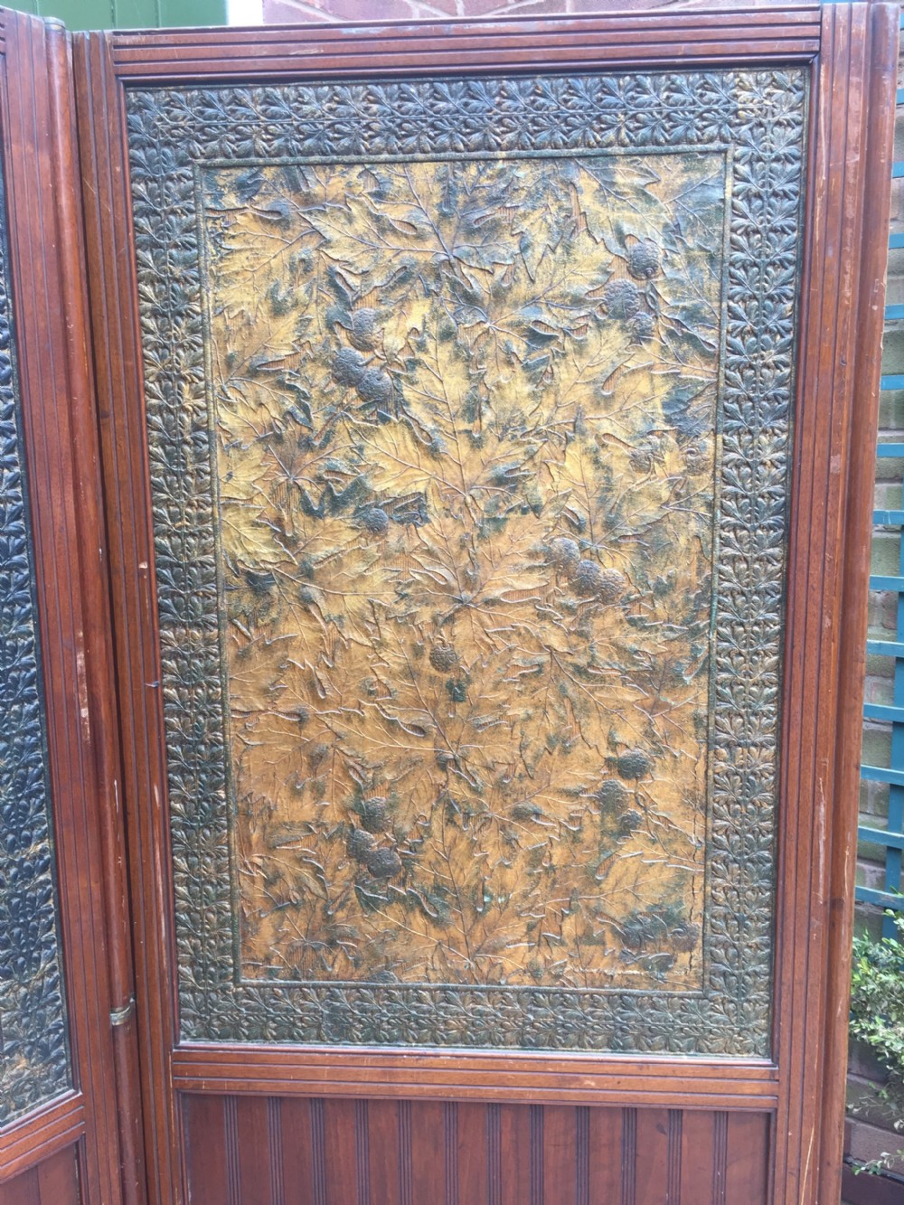 Late C19th mahogany and tooled leather 3-fold room-divider or screen . View II