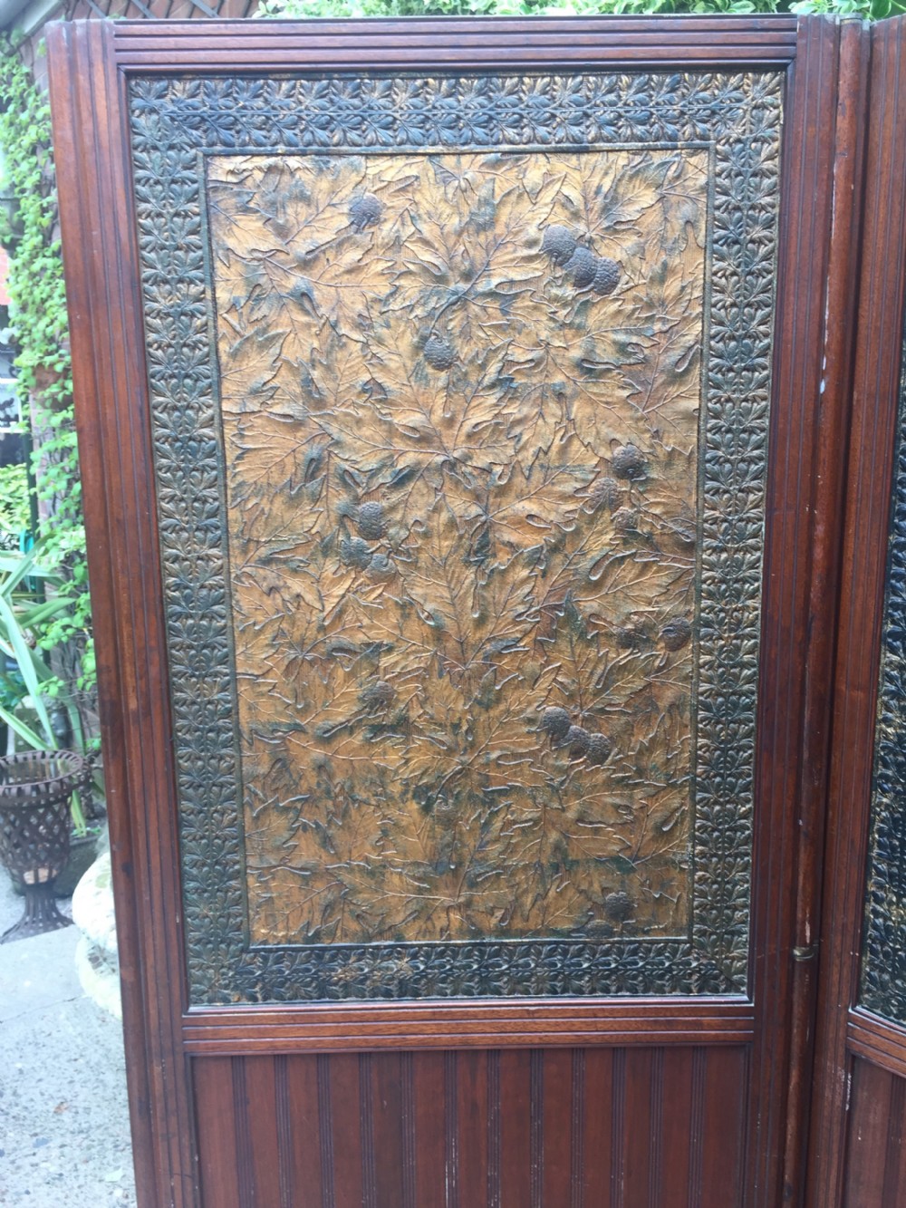 Late C19th mahogany and tooled leather 3-fold room-divider or screen . View V