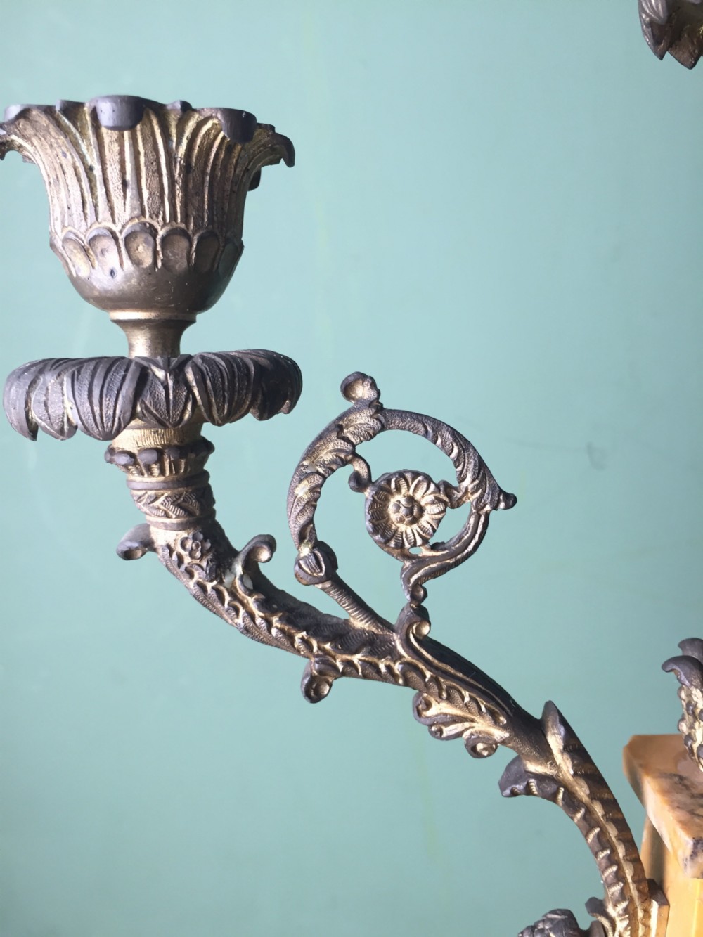 A late nineteenth-century French Empire style clock garniture crafted from yellow Siena marble and gilt ormolu, featuring a central clock topped with an eagle and flanked by two candelabra. View XVIII