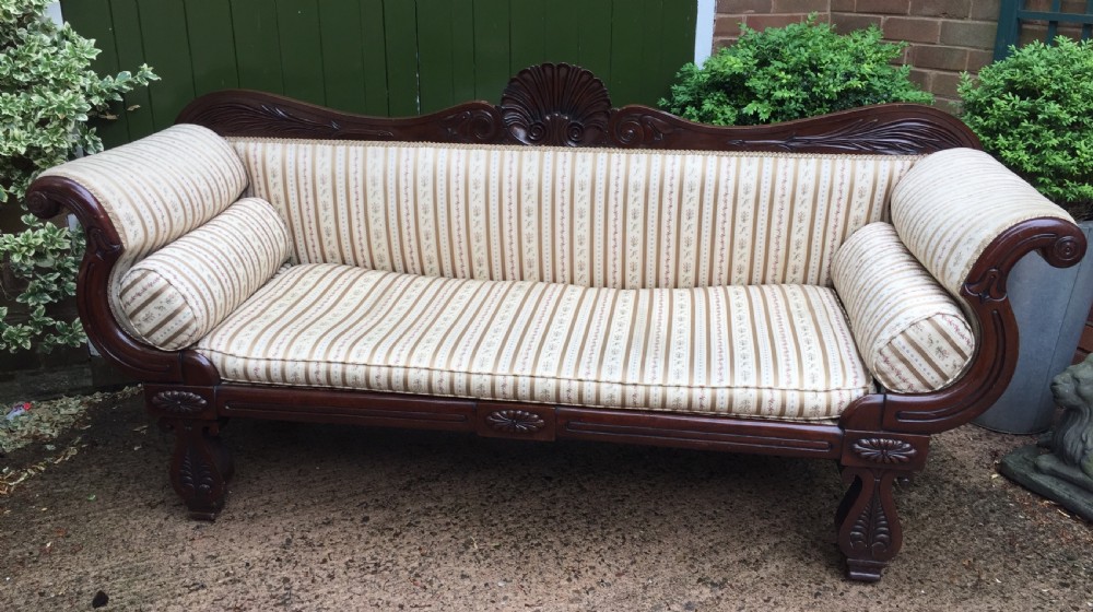 Early C19th Regency period mahogany scroll-end double-ended sofa of classically inspired design. View III