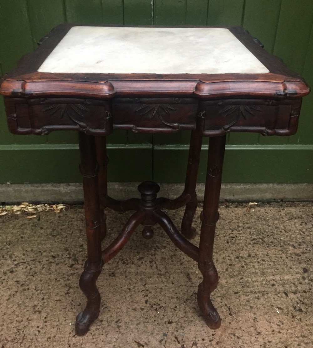 Late C19th Chinese Qing Dynasty carved hardwood square centre table with inset marble top.