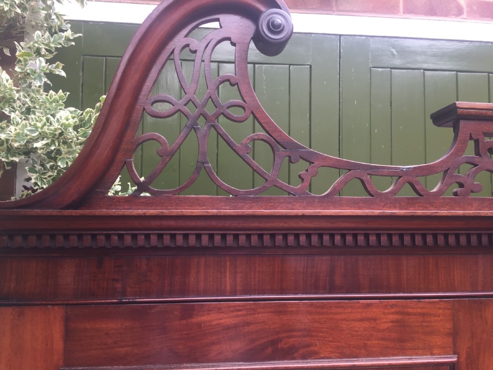 Rare George III Chippendale period and design padouk and mahogany linen-press or wardrobe with open fret-work 