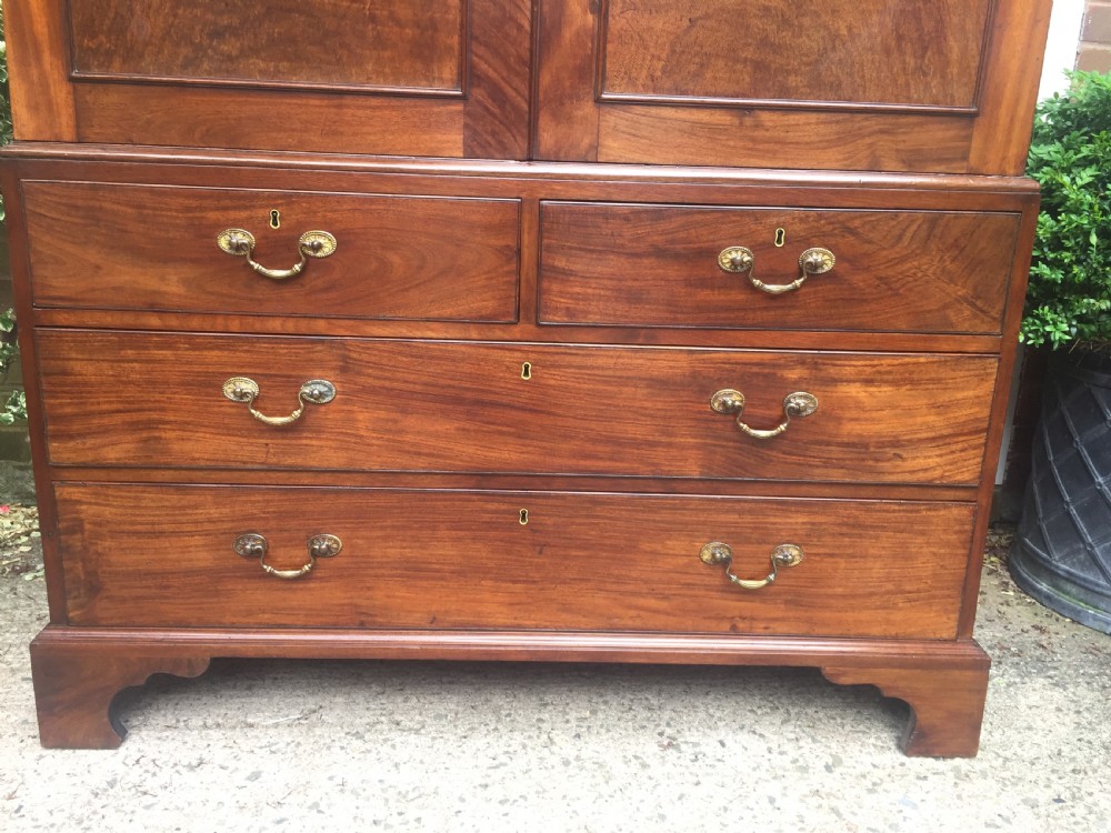 Rare George III Chippendale period and design padouk and mahogany linen-press or wardrobe with open fret-work 