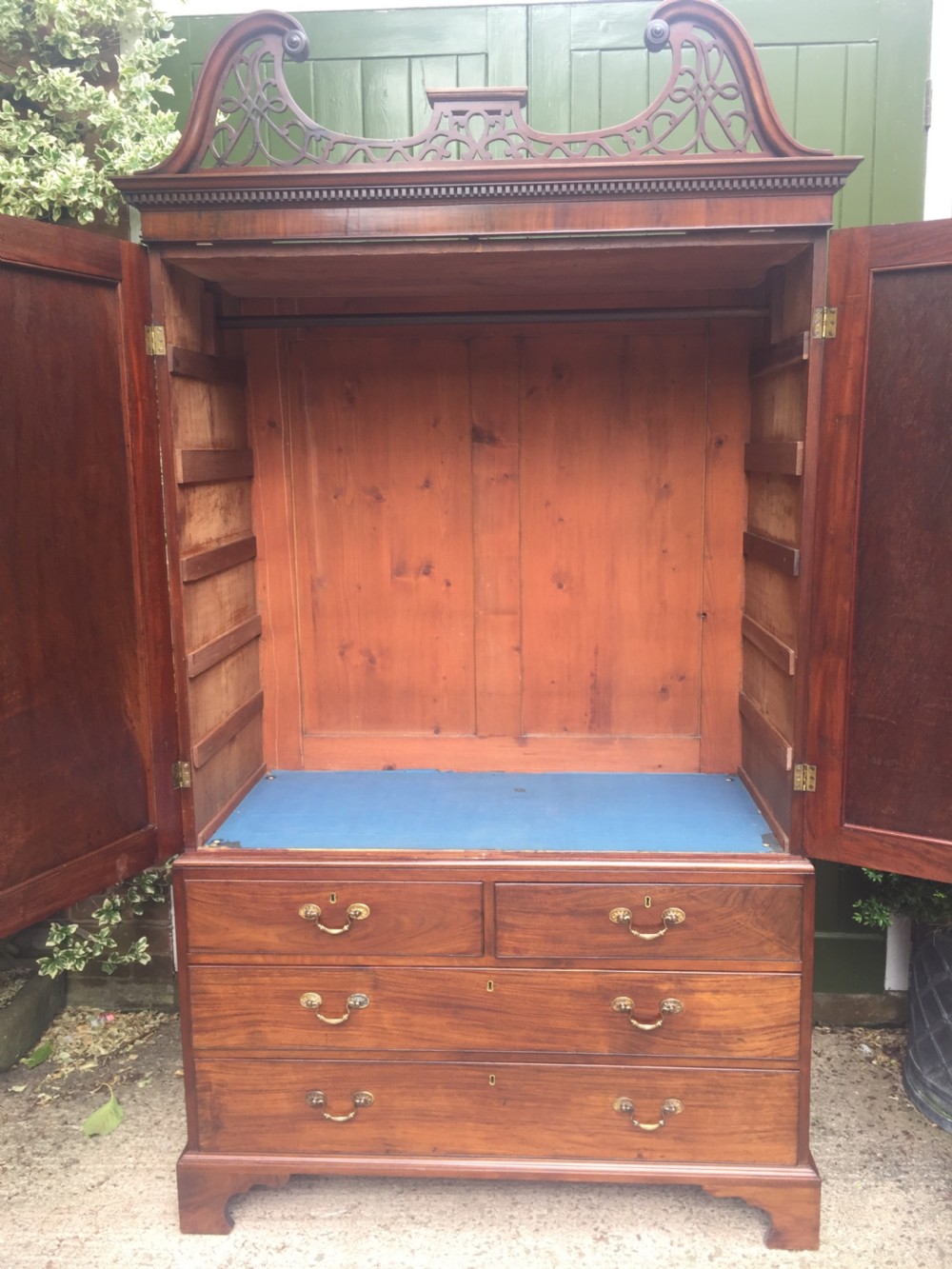 Rare George III Chippendale period and design padouk and mahogany linen-press or wardrobe with open fret-work 