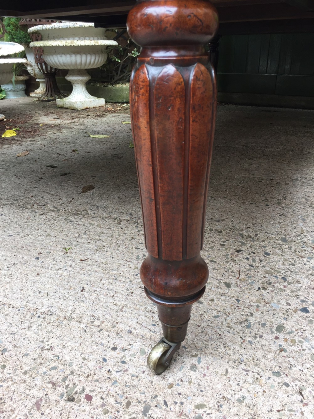 Early C19th Regency period mahogany extending dining table with 3 original additional leaves . View III