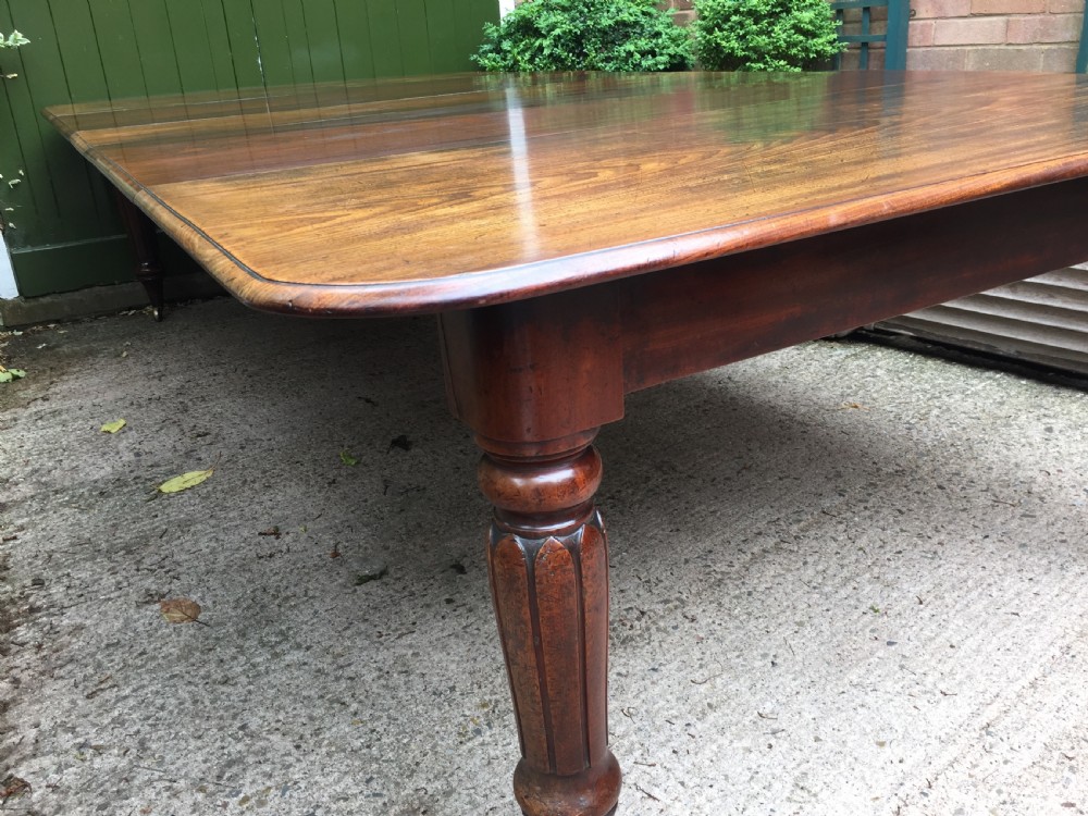 Early C19th Regency period mahogany extending dining table with 3 original additional leaves . View VI