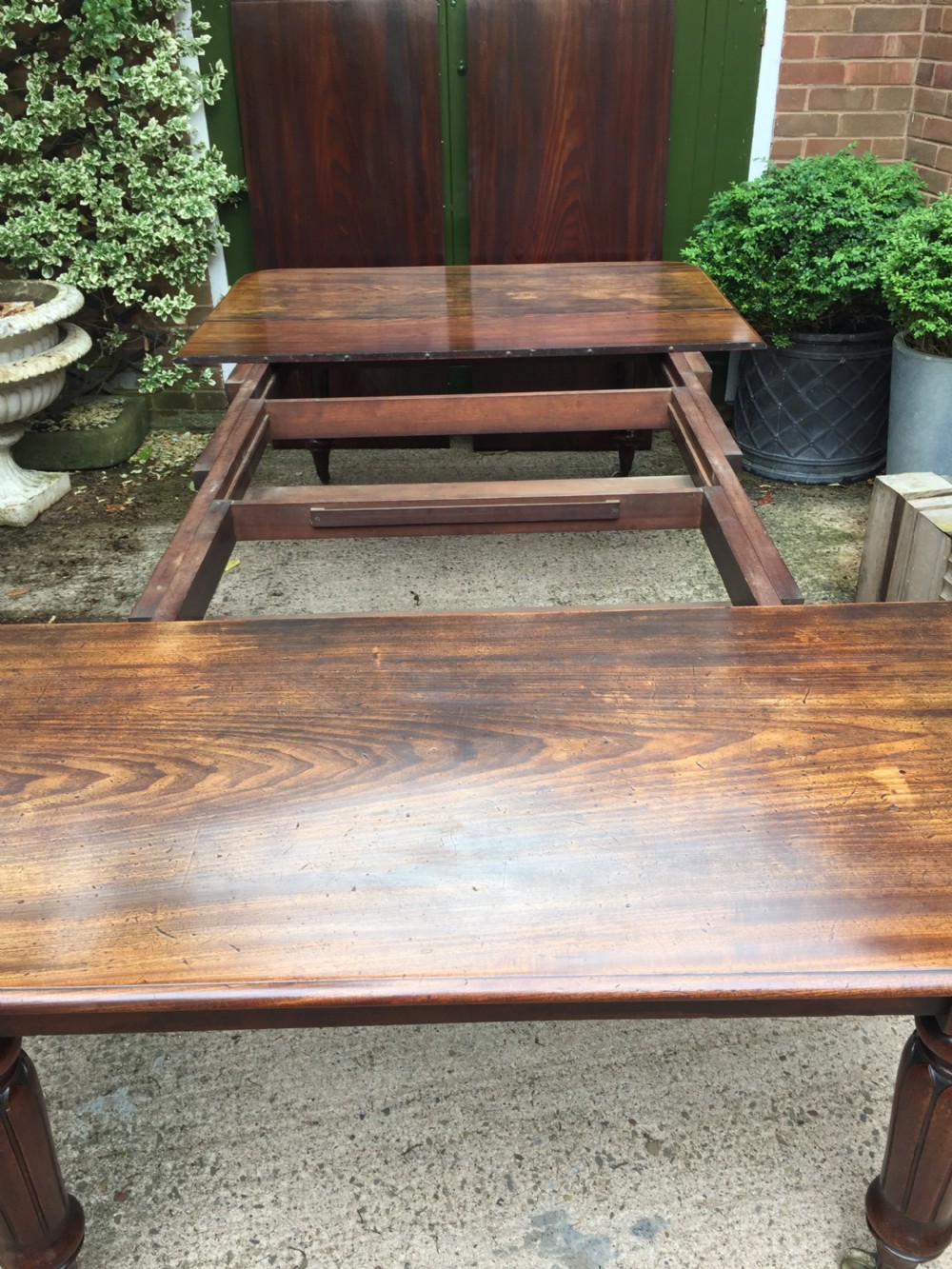Early C19th Regency period mahogany extending dining table with 3 original additional leaves . View XII